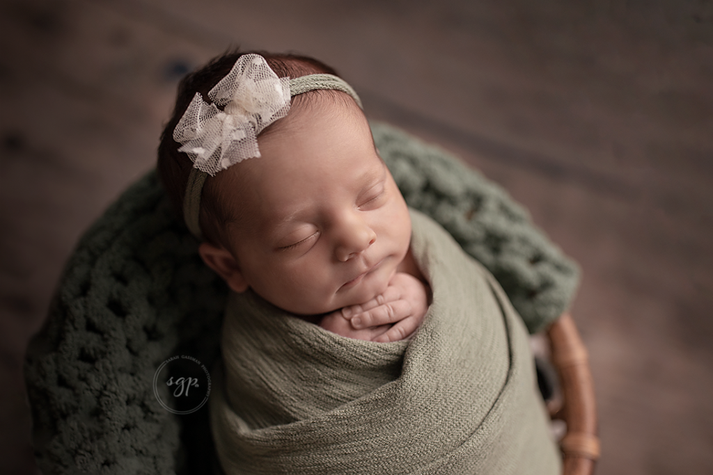 baby girl in sage and lace at in-home newborn photo session in Tomball TX, Cypress TX newborn photographer