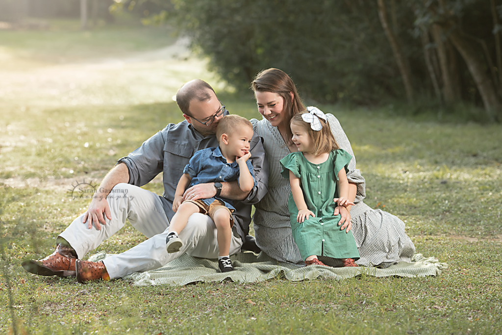 candid family sweet moment in earthy colors at family photo session Houston, Cypress Texas family photographer
