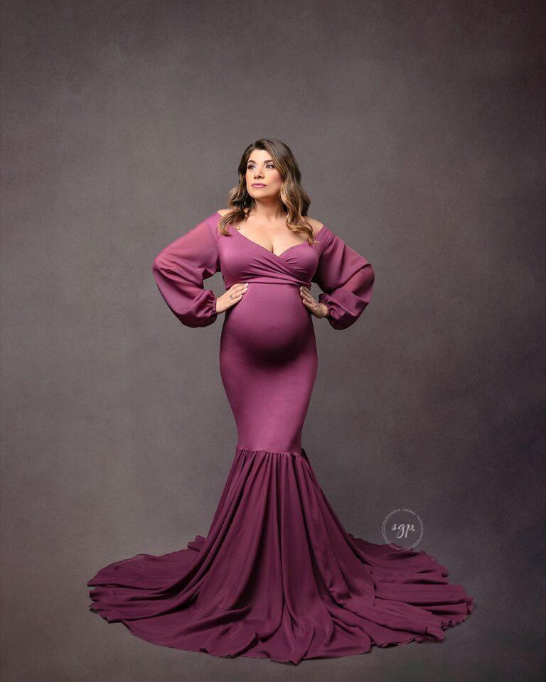 pregnant mom in long mauve, mermaid dress at maternity photoshoot in her home in Houston, Texas. Houston maternity photographer