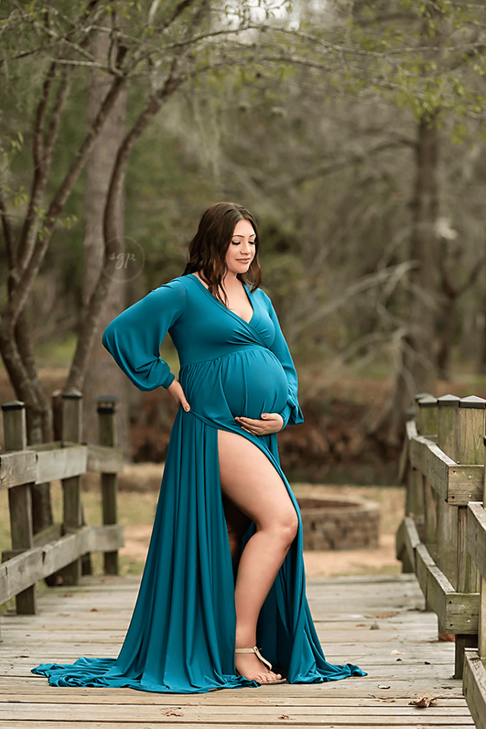 maternity photo session of mom in teal on bridge, Cypress TX maternity photographer