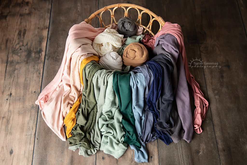 always growing collection of wraps and backdrops in many colors and textures to be used at Houston in-home newborn photo sessions by Houston newborn photographer