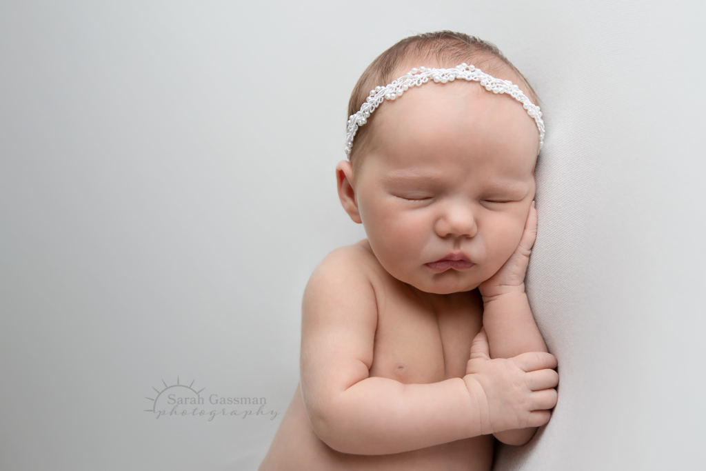 baby girl in white sleeping at newborn photo session in her home, jersey village Texas, Houston newborn photographer