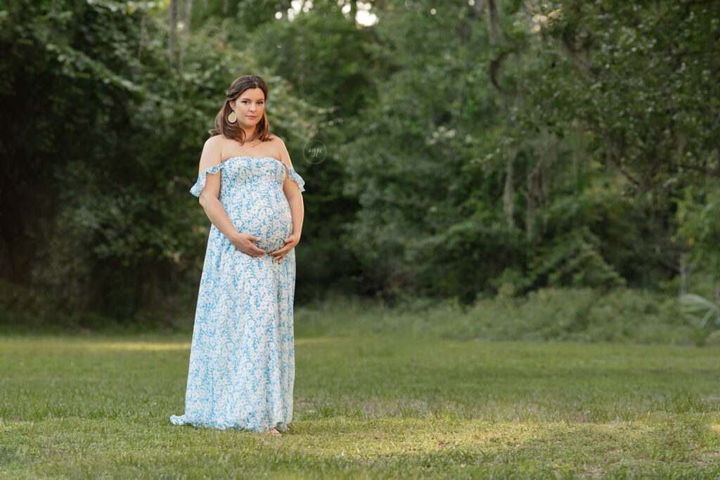 mom to be in blue floral dress days away from giving birth